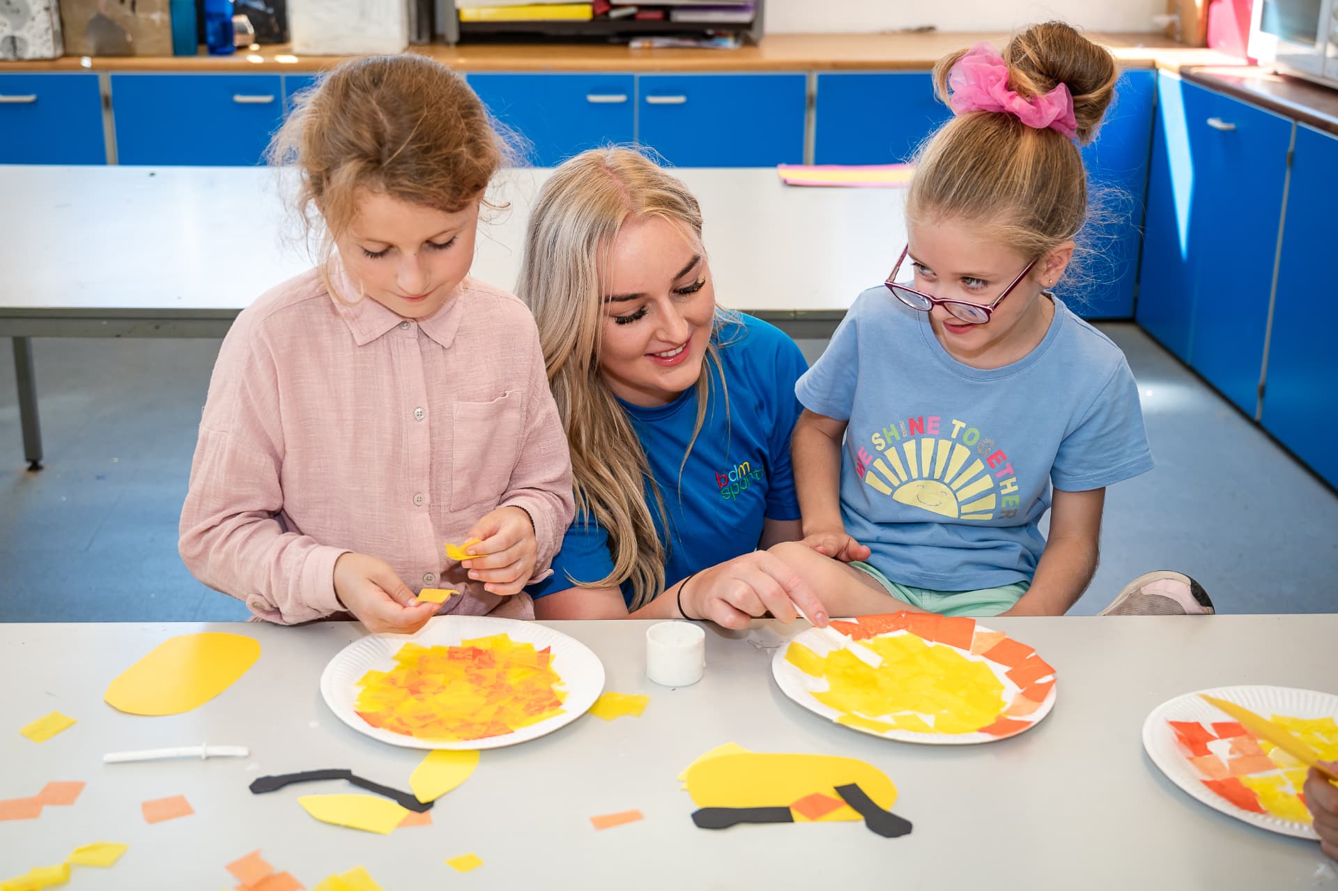 Children working together with a BDM coach